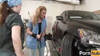 The girl is having fun with another girl in the garage