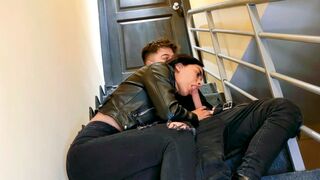 A hot chick is having fun on the stairs of her apartment