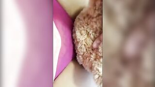 A girl is humping a teddy bear and getting horny with it