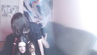 A couple enjoys intimate moments on the couch while listening to music