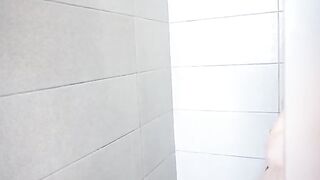 My step sister is having fun in the shower with a toy