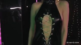 Skinny teen AngelQ stripping on a stage in black lingerie