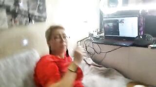 A mature woman is playing naughty games with her pussy on camera