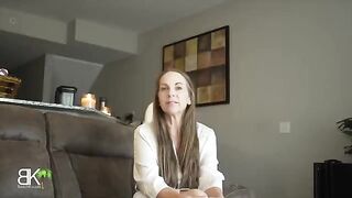 A stepmom shares a couch with her stepson in a taboo scene