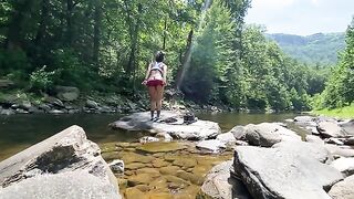 An amateur couple has sex right in the river while hiking