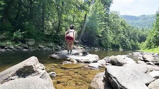 An amateur couple has sex right in the river while hiking