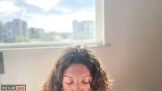 Cute wife showcases her skills in front of strangers through an open window