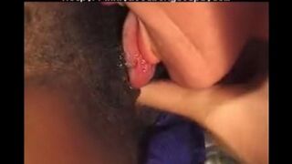 A young black girl has fun with an older white guy