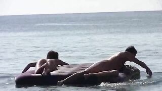 Nude beauties have fun on sunny beach