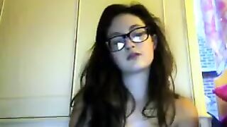 A student with glasses plays with her body in a video chat