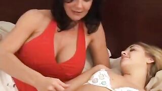 Lesbian beauties fuck using a strap-on, embodying passionate and romantic sex