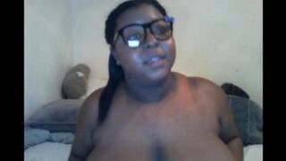 The black woman closed the camera with her big natural tits during a steamy session