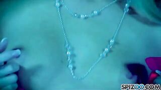 A blonde girl caresses her pussy with a big dildo