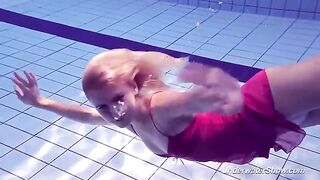 Helen has a swimming session in the pool without any clothes on