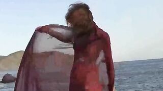 Nudist girl got her small boobs wet in the rain