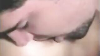A guy fucks a girl with a strapon, while another plays with his cock