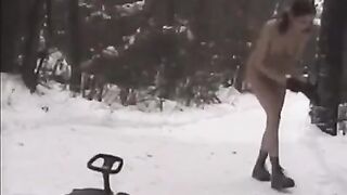 Nude girls play snowball fight in the street during a winter wonderland