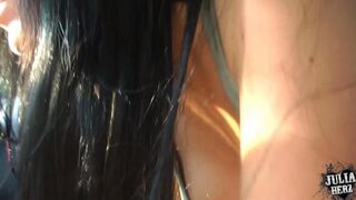 A sexy brunette girl makes a blowjob in the car, showcasing her stunning natural big tits