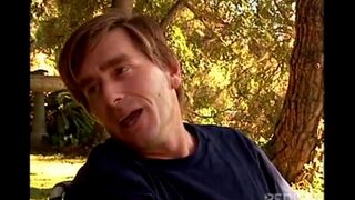 A young and beautiful girl is having fun with a guy in nature