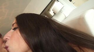 Two girls, Lena Nicole and Serena Blair, are fucking on the couch in a steamy session