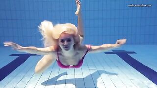 Naked beauty swimming in the pool is a very exciting scene