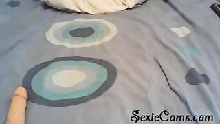 A cute girl tests her new toys in front of a webcam