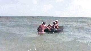 A naked girl is having fun on the beach mattress in HD