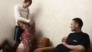 A mature woman fucks her son and his friend