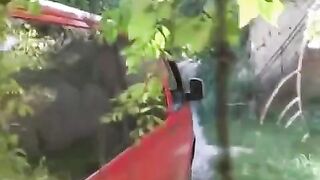 The man squeezed her tits near a car and fucked her