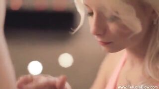 A blonde woman has a blowjob session in the studio