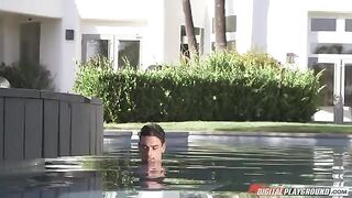 A hot brunette with huge tits is fucking in the pool