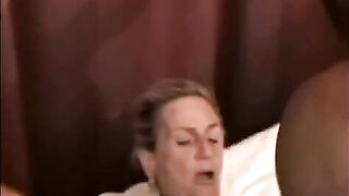 A beautiful mature woman is fucking with a black guy