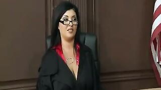 A mature woman with big boobs is wearing a police uniform