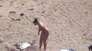A pair of naked people enjoy each other on the sea
