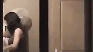 He admires his reflection in the mirror, completely naked