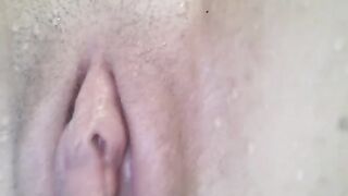 Bikini-clad beauty gets her pussy wet and fingers crossed in the pool