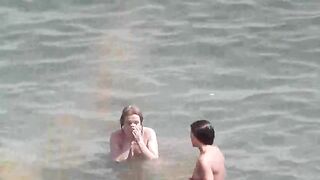 Nude beauties bathing in the sea