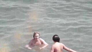 Nude beauties bathing in the sea