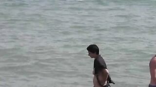 Nude beauties bathing in the sea