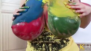 A woman creates a picture and caresses herself with her fingers