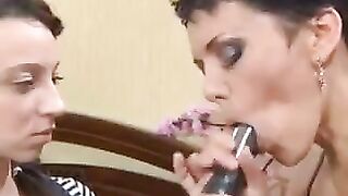 A mother introduces a Russian girl to the art of oral pleasure using a strapon