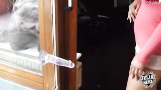 A sexy brunette girl plays with her huge boobs using a dildo
