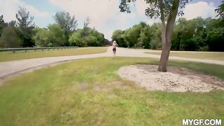 A young girl is having fun with her boyfriend at the park