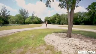 A young girl is having fun with her boyfriend at the park