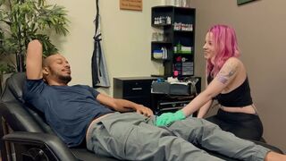 A hot girl with a tattoo is having fun with a guy