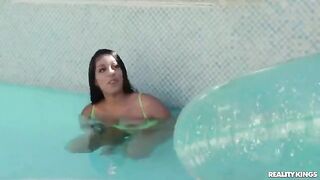 The lesson of swimming for a cute girl in the pool