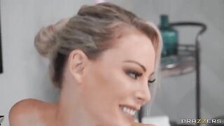 A mature blonde is having fun in the bathroom with a man’s balls