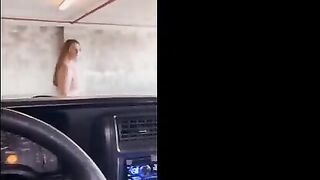 Redhead babe is getting fucked in the public garage and she comes