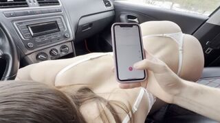 Girl has sex in the car and makes a phone stand