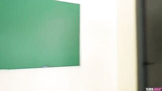 A black fan is blowing directly on the crotch of a blonde teacher